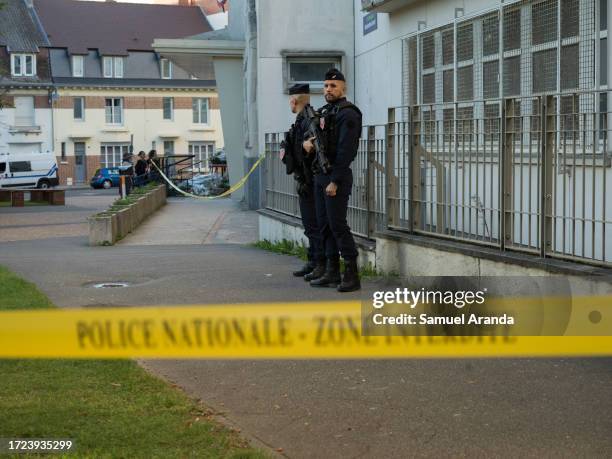 Police patrol at the Gambetta-Carnot public school where Dominique Bernard, a teacher was fatally stabbed yesterday, on October 14, 2023 in Arras,...