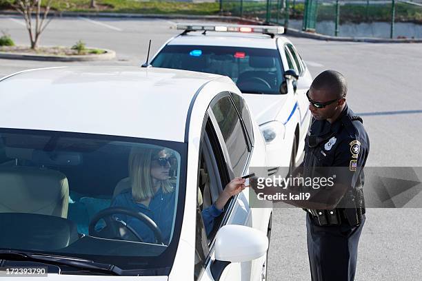 woman pulled over by police - pulled over by police stock pictures, royalty-free photos & images