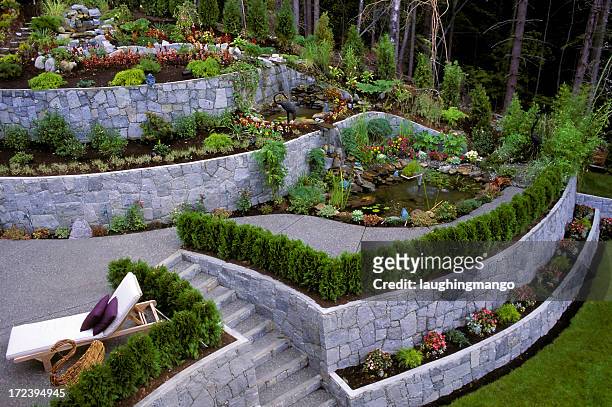 landscaped garden retaining wall - landscaped stock pictures, royalty-free photos & images