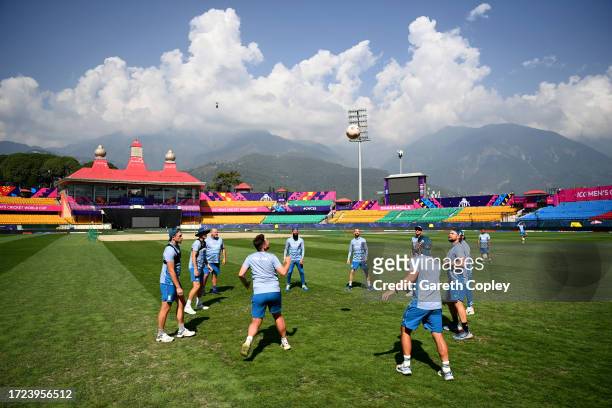 England warm up with a game of PIG during a nets session at Himachal Pradesh Cricket Association Stadium on October 08, 2023 in Dharamsala, India.