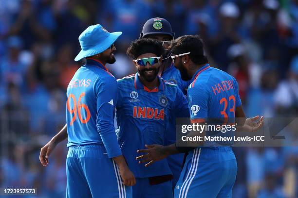 Ravindra Jadeja of India celebrates with teammates after taking the wicket of Steve Smith of Australia during the ICC Men's Cricket World Cup India...