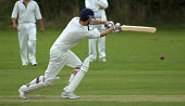 Cricketer playing cut shot