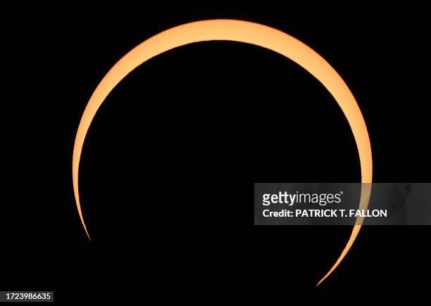 The Moon crosses in front of the Sun over Albuquerque, New Mexico, during an annular eclipse on October 14, 2023.