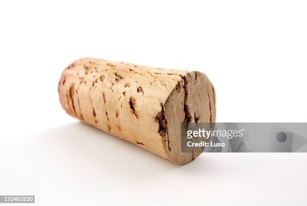 close up of a used wine cork on white background - champagne cork stock pictures, royalty-free photos & images