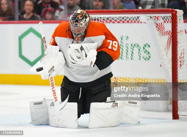 Carter Hart of the Philadelphia Flyers makes a save against the Ottawa Senators at Canadian Tire Centre on October 14, 2023 in Ottawa, Ontario,...
