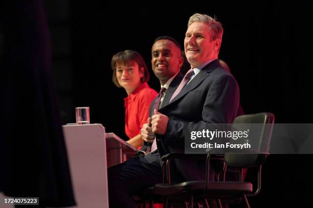 Labour leader, Sir Keir Starmer, looks on as an uninvited speaker is removed from the podium during day one of the annual Labour party conference on...