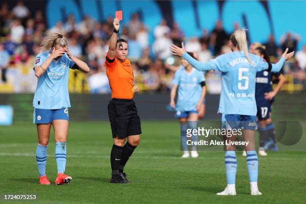 Referee, Emily Heaslip shows a red card to Alex Greenwood of Manchester City during the Barclays Women´s Super League match between Manchester City...