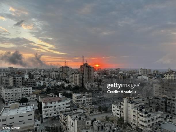 Smoke rises after Israeli attacks during the sunset in Gaza City, Gaza on October 14, 2023.