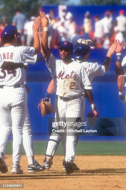 Damon Buford of the New York Mets celebrates a win after a baseball game against the Los Angeles Dodgers on August 20, 1995 at Shea Stadium in New...