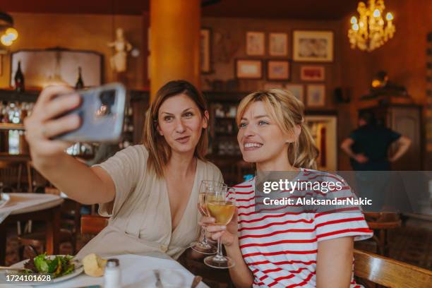 capturing a selfie from our outing together - griekse-gerechten stockfoto's en -beelden