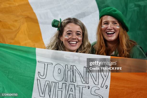 Ireland's supporters cheer in the stands with national flags ahead of the France 2023 Rugby World Cup quarter-final match between Ireland and New...