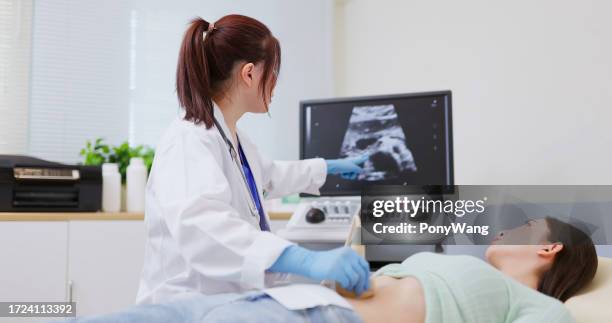 woman belly ultrasound examination - colorectal cancer stockfoto's en -beelden