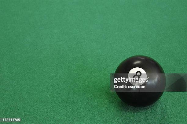 close-up of an eight ball on pool table - 8 ball pool stock pictures, royalty-free photos & images