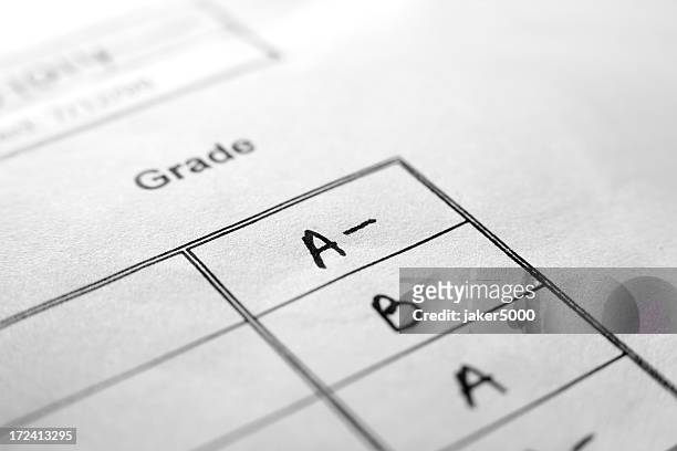 an up close picture of report card grades - exam paper stock pictures, royalty-free photos & images