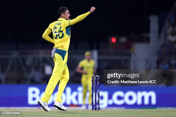 Mitchell Starc of Australia celebrates the wicket of Ishan Kishan of India during the ICC Men's Cricket World Cup India 2023 between India and...