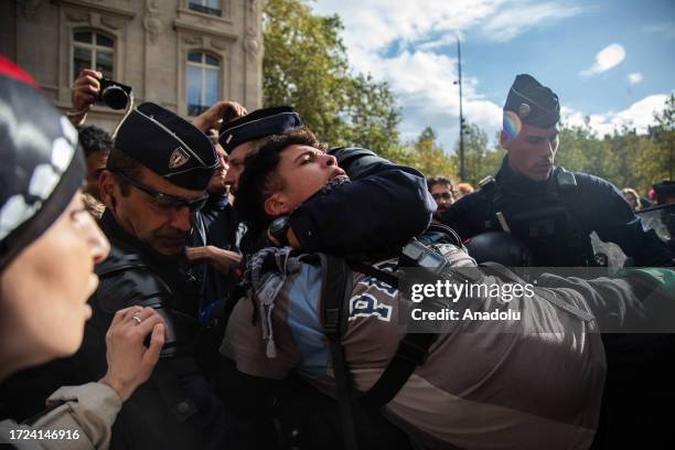 French riot police detains people demonstrating in support of Palestinians at the Republique Square in Paris, France on October 14, 2023.