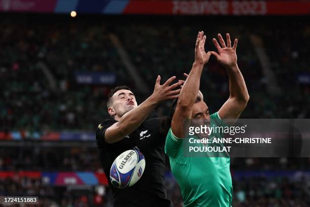 New Zealand's right wing Will Jordan and Ireland's left wing James Lowe fight for the ball during the France 2023 Rugby World Cup quarter-final match...