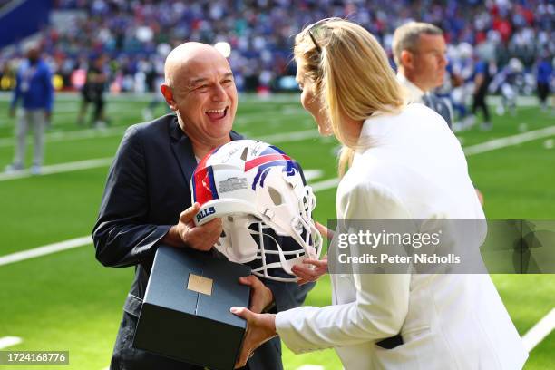 Chairman of Tottenham Hotspur, Daniel Levy receives a Buffalo Bills helmet prior to the NFL Match between Jacksonville Jaguars and Buffalo Bills at...