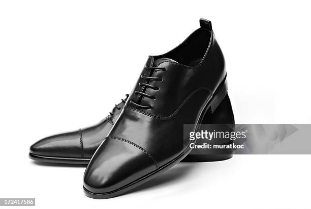 elegant black leather shoes - sole of shoe stockfoto's en -beelden