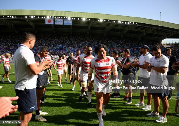 The players of Japan are given a guard of honour by the players of Argentina as they leave the pitch at full-time following the Rugby World Cup...