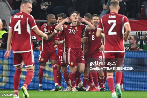 Hungary's forward Roland Sallai celebrates scoring the 2-1 goal with his team-mates during the UEFA Euro 2024 Group G qualification football match...