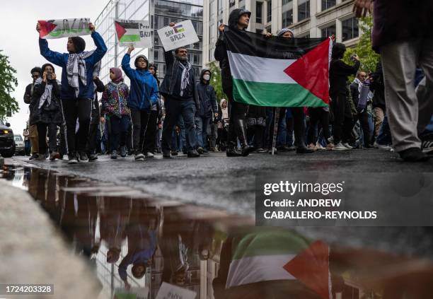 People demonstrate during a pro-Palestine rally at Lafayette Square in front of the White House in Washington, DC, on October 14, 2023. Thousands of...