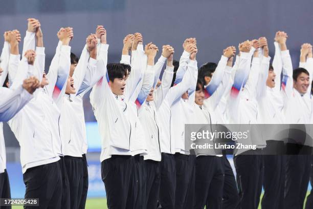 Players of South Korea celebrate the gold medal during the award ceremony after the 19th Asian Game men's gold medal match between South Korea and...