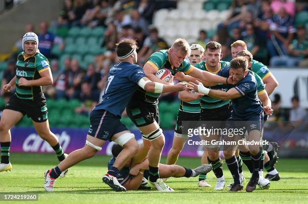 Tom Pearson of Northampton Saints runs with the ba during the Premiership Rugby Cup match between Northampton Saints and Doncaster Knights at cinch...