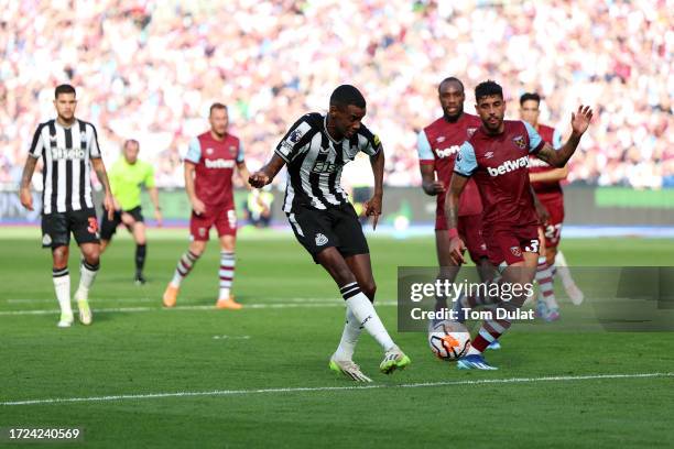 Alexander Isak of Newcastle United scores their sides first goal during the Premier League match between West Ham United and Newcastle United at...