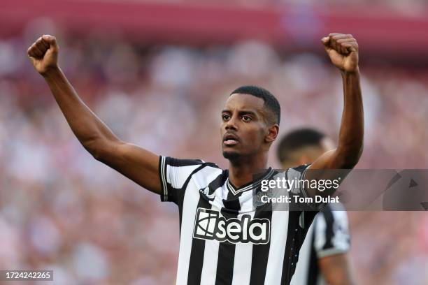 Alexander Isak of Newcastle United celebrates after scoring their sides first goal during the Premier League match between West Ham United and...