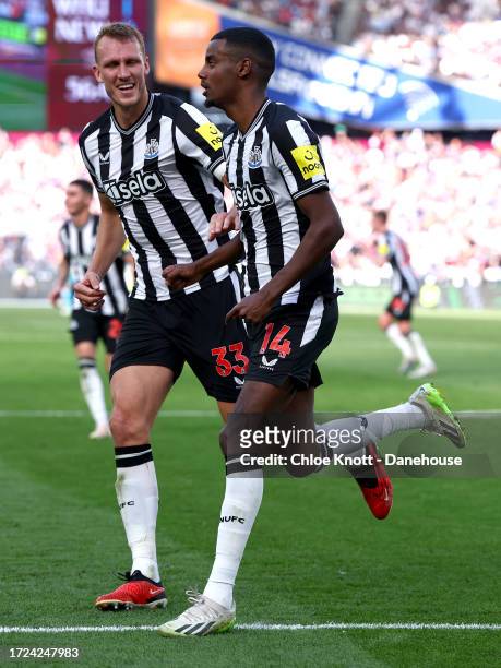 Alexander Isak of Newcastle United celebrates scoring their teams first goal during the Premier League match between West Ham United and Newcastle...
