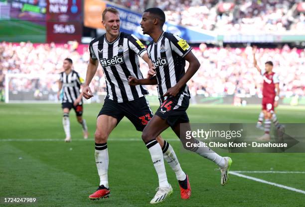 Alexander Isak of Newcastle United celebrates scoring their teams first goal during the Premier League match between West Ham United and Newcastle...