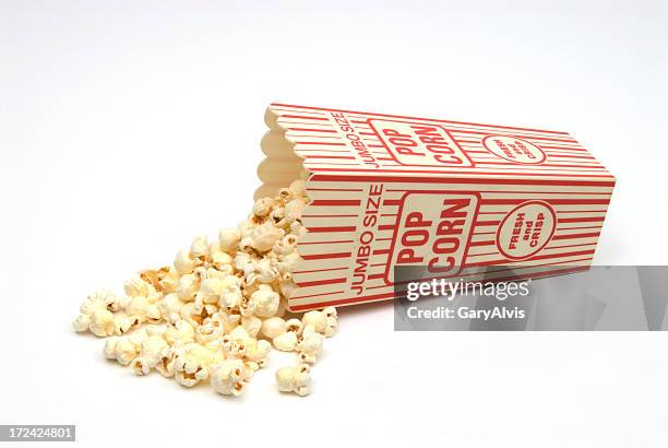 popcorn spilling from red and white popcorn box-isolated on white - pop corn stock pictures, royalty-free photos & images