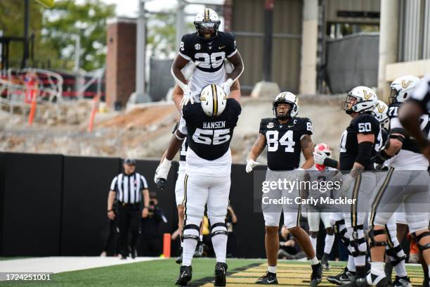 Gunnar Hansen and Miles Capers of the Vanderbilt Commodores celebrate a touchdown against the Georgia Bulldogsin the first half at FirstBank Stadium...