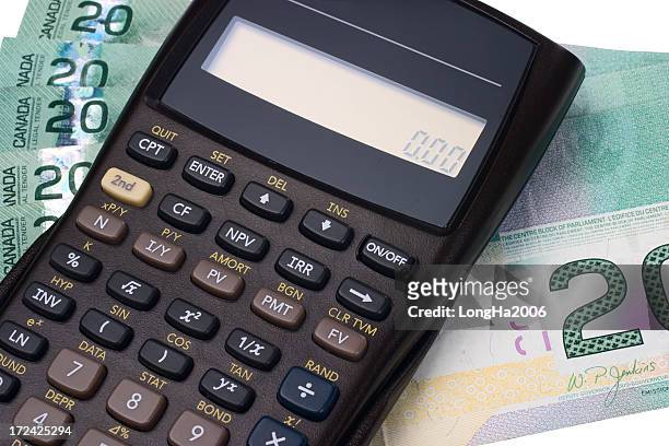 a calculator and paper money notes - canadian dollars stock pictures, royalty-free photos & images
