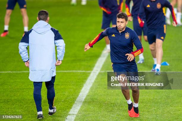 Spain's midfielder Rodrigo Hernandez takes part in a training session at Ullevaal Stadium on the eve of the UEFA Euro 2024 Group A qualification...