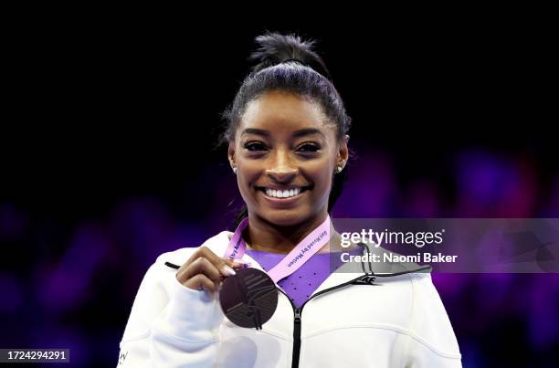 Simone Biles of Team United States celebrates winning gold on the Beam on Day Nine of the 2023 Artistic Gymnastics World Championships at Antwerp...