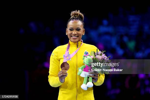 Rebeca Andrade of Team Brazil celebrates with her medal after winning bronze on Beam during the Women's Apparatus Finals on Day Nine of the 2023...
