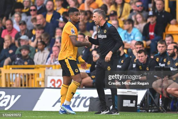 Mario Lemina of Wolverhampton Wanderers interacts with Gary O'Neil, Manager of Wolverhampton Wanderers, after receiving a red card during the Premier...