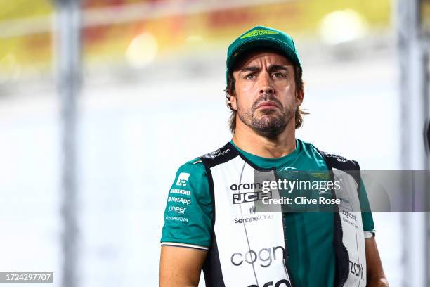 Fernando Alonso of Spain and Aston Martin F1 Team looks on from the drivers parade prior to the F1 Grand Prix of Qatar at Lusail International...