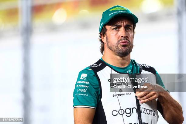 Fernando Alonso of Spain and Aston Martin F1 Team looks on from the drivers parade prior to the F1 Grand Prix of Qatar at Lusail International...