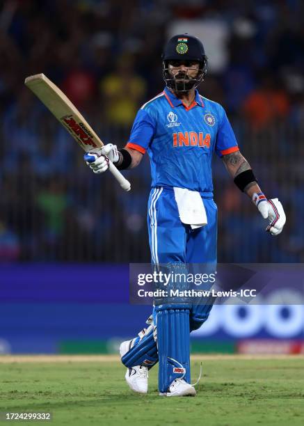 Virat Kohli of India celebrates reaching a half century during the ICC Men's Cricket World Cup India 2023 between India and Australia at MA...