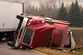 Truck crash with turned over semi
