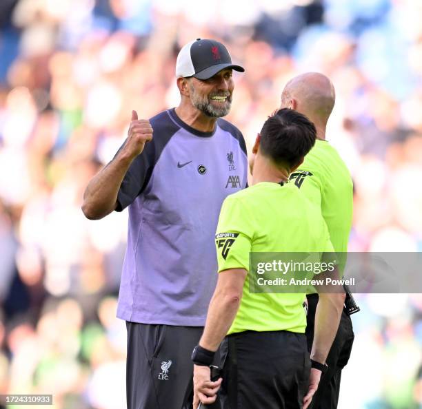Jurgen Klopp manager of Liverpool talking with referee Anthony Taylor at the end of the Premier League match between Brighton & Hove Albion and...