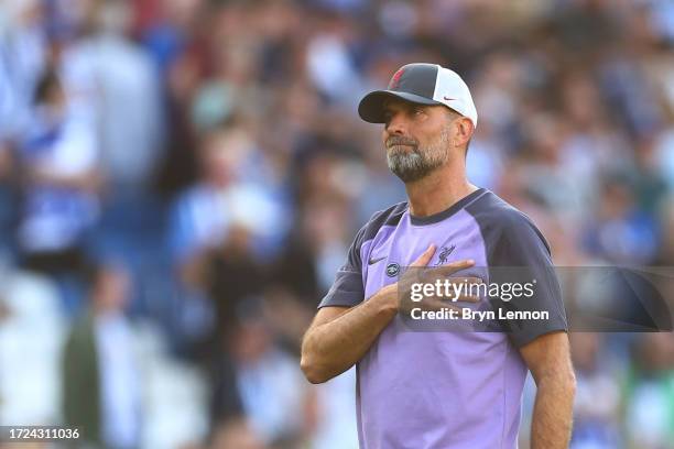 Juergen Klopp, Manager of Liverpool, acknowledges the fans following the Premier League match between Brighton & Hove Albion and Liverpool FC at...