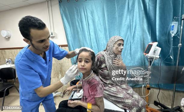 Citizens, including children, injured as a result of Israeli attacks are taken to hospital for treatment as Israel's attacks on the Gaza Strip...