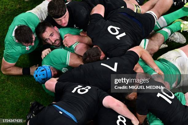 Ireland's flanker Jack Conan tries to release the ball from a ruck during the France 2023 Rugby World Cup quarter-final match between Ireland and New...