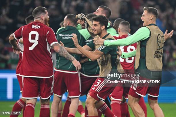 Hungary's players celebrate at the final whistle of the UEFA Euro 2024 Group G qualification football match Hungary v Serbia at the Puskas Arena of...