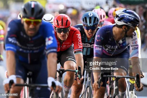 Arnaud Demare of France and Team Arkéa Samsic and John Degenkolb of Germany and Team dsm - firmenich cross the finish line during the 117th Paris -...
