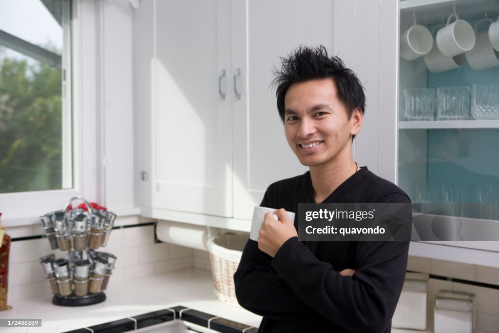 Asian Young Man in Home Kitchen with Coffee Mug, Copyspace